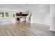 Open concept room featuring hardwood flooring and lots of natural light at 209 Groveton Ct, Euharlee, GA 30145