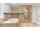Bathroom featuring tile flooring and a tiled shower and tub at 2892 Cardinal Lake Dr, Duluth, GA 30096