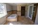 Luxurious bathroom with a soaking tub, tiled walls, and a separate shower room at 2892 Cardinal Lake Dr, Duluth, GA 30096