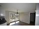 Bright dining area with modern lighting fixture and walkout patio doors at 2892 Cardinal Lake Dr, Duluth, GA 30096