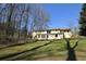The house is set on a sprawling lot with mature trees, a spacious lawn, and a welcoming facade at 2892 Cardinal Lake Dr, Duluth, GA 30096