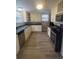 Well-lit kitchen with granite countertops, modern appliances, and ample cabinet space at 2892 Cardinal Lake Dr, Duluth, GA 30096