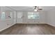 Inviting living room boasts hard surface floors, white trim, a ceiling fan and plenty of light at 2892 Cardinal Lake Dr, Duluth, GA 30096