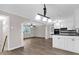 Open living space featuring new modern floors, white trim, and an open concept kitchen at 2892 Cardinal Lake Dr, Duluth, GA 30096