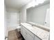 Bathroom featuring a granite vanity, mirror, and shower-tub combination at 5342 Legacy Trl, Douglasville, GA 30135