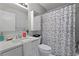 Clean, bright bathroom with a white sink, modern fixtures, and colorful shower curtain at 700 Bayliss Dr, Marietta, GA 30068
