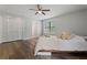 Spacious bedroom with closet, hardwood floors, and large window at 700 Bayliss Dr, Marietta, GA 30068
