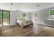 Spacious bedroom featuring hardwood floors, neutral paint, lots of natural light and sliding glass door to the outside at 700 Bayliss Dr, Marietta, GA 30068