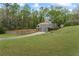 A charming home featuring a bay window and a long driveway leading to a two-car garage at 700 Bayliss Dr, Marietta, GA 30068