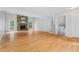 Spacious living room featuring hardwood floors, a fireplace, and ample natural light at 700 Bayliss Dr, Marietta, GA 30068
