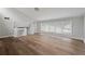 Open loft featuring hardwood floors and large windows providing natural light at 700 Bayliss Dr, Marietta, GA 30068