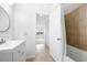 Bathroom with neutral tile, updated sink, and shower at 73 Rumson Se Ct, Smyrna, GA 30080