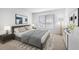 Primary bedroom showcasing large window, decorative rug, and modern decor at 73 Rumson Se Ct, Smyrna, GA 30080