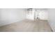 Bedroom featuring carpeted floors, a window, and modern shelves at 73 Rumson Se Ct, Smyrna, GA 30080