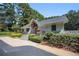 Charming clubhouse featuring stone accents, a welcoming entryway, and beautiful landscaping at 73 Rumson Se Ct, Smyrna, GA 30080
