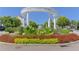 Smyrna Market Village entrance with lush floral landscaping at 73 Rumson Se Ct, Smyrna, GA 30080