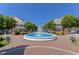 Beautiful fountain surrounded by trees and benches in front of charming two-story buildings at 73 Rumson Se Ct, Smyrna, GA 30080
