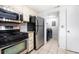 Efficient kitchen layout with stainless appliances, and adjacent laundry space at 73 Rumson Se Ct, Smyrna, GA 30080