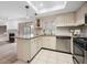 Well-lit kitchen featuring granite countertops, white cabinets, and stainless steel appliances at 73 Rumson Se Ct, Smyrna, GA 30080