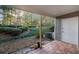 Private outdoor patio surrounded by mature trees and well-manicured landscaping, offering a tranquil retreat at 73 Rumson Se Ct, Smyrna, GA 30080