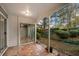 Private patio with tile flooring, surrounded by mature landscaping and lush greenery for outdoor relaxation at 73 Rumson Se Ct, Smyrna, GA 30080