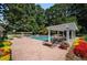 Community swimming pool with relaxing lounge chairs and lush green surroundings at 73 Rumson Se Ct, Smyrna, GA 30080
