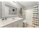 Bright bathroom features a large mirror, decorative accents, and a shower-tub combo for relaxation and convenience at 1119 Brownstone Dr, Marietta, GA 30008