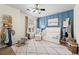 Charming Bedroom with board and batten accent wall, ceiling fan, and natural light, perfect for a growing Gathering at 1119 Brownstone Dr, Marietta, GA 30008