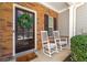 Charming front porch featuring a decorative wreath and rocking chairs at 1119 Brownstone Dr, Marietta, GA 30008
