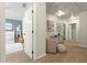 Welcoming hallway with neutral tones, leading to a cozy, carpeted bedroom with a decorative blue accent wall at 1119 Brownstone Dr, Marietta, GA 30008
