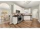 Stylish kitchen with stainless steel appliances, granite countertops, and white cabinetry offers a modern cooking space at 1119 Brownstone Dr, Marietta, GA 30008