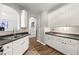 Open kitchen features granite countertops, white cabinets, and seamlessly transitions into a bright, inviting dining area at 1119 Brownstone Dr, Marietta, GA 30008
