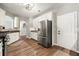 Well-lit kitchen features stainless steel appliances, white cabinets, and a convenient layout for efficient meal preparation at 1119 Brownstone Dr, Marietta, GA 30008