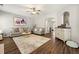 Bright living room features a large rug, hardwood floors, and neutral walls at 1119 Brownstone Dr, Marietta, GA 30008