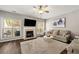 Comfortable living room with a fireplace, natural light, and hardwood floors at 1119 Brownstone Dr, Marietta, GA 30008