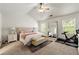 Bright main bedroom with vaulted ceiling, plush bed, and large windows, creating a serene retreat at 1119 Brownstone Dr, Marietta, GA 30008