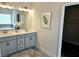 Elegant bathroom featuring double vanity, modern lighting, and a large mirror at 141 Lynn Top Rdg, Dallas, GA 30157