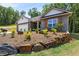 Charming single Gathering home with manicured lawn and lovely stone and brick exterior at 141 Lynn Top Rdg, Dallas, GA 30157