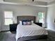Bright main bedroom with a large bed, comfortable furniture, and plenty of natural light at 141 Lynn Top Rdg, Dallas, GA 30157