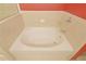 Bathroom featuring a bright white soaking tub with chrome faucet at 390 17Th Nw St # 2024, Atlanta, GA 30363