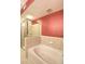 Bathroom features a glass enclosed shower and soaking tub at 390 17Th Nw St # 2024, Atlanta, GA 30363