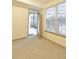 Bright bedroom featuring neutral carpet and view to outdoor space at 390 17Th Nw St # 2024, Atlanta, GA 30363