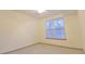 Bright bedroom featuring neutral carpet, paint and window with blinds at 390 17Th Nw St # 2024, Atlanta, GA 30363