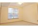 Bedroom with neutral carpet, ceiling fan and natural light from the window at 390 17Th Nw St # 2024, Atlanta, GA 30363