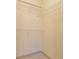 Walk-in closet with built in shelving, and neutral carpeting at 390 17Th Nw St # 2024, Atlanta, GA 30363