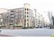 Street view of apartment building with sidewalks and street at 390 17Th Nw St # 2024, Atlanta, GA 30363