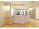 Kitchen offers a breakfast bar, stainless appliances and a view to the living area at 390 17Th Nw St # 2024, Atlanta, GA 30363