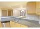Modern kitchen featuring granite counters, stainless appliances and an open layout at 390 17Th Nw St # 2024, Atlanta, GA 30363