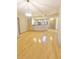 Open-concept living area boasts hardwood floors and natural light at 390 17Th Nw St # 2024, Atlanta, GA 30363