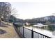 Picturesque pond with a bridge and fountain, surrounded by lush greenery and a walking path at 390 17Th Nw St # 2024, Atlanta, GA 30363